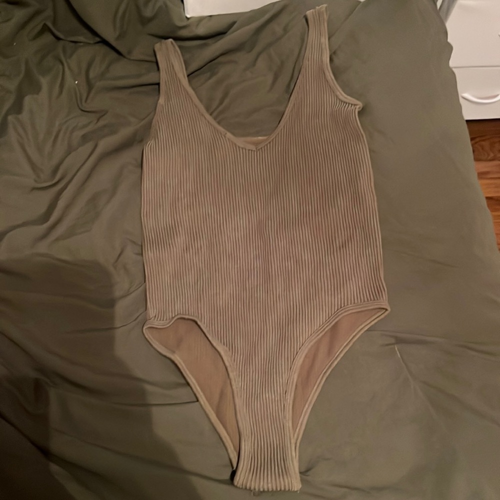 green body suit (looks brown bc of my bedding but is green) size M/L, never worn